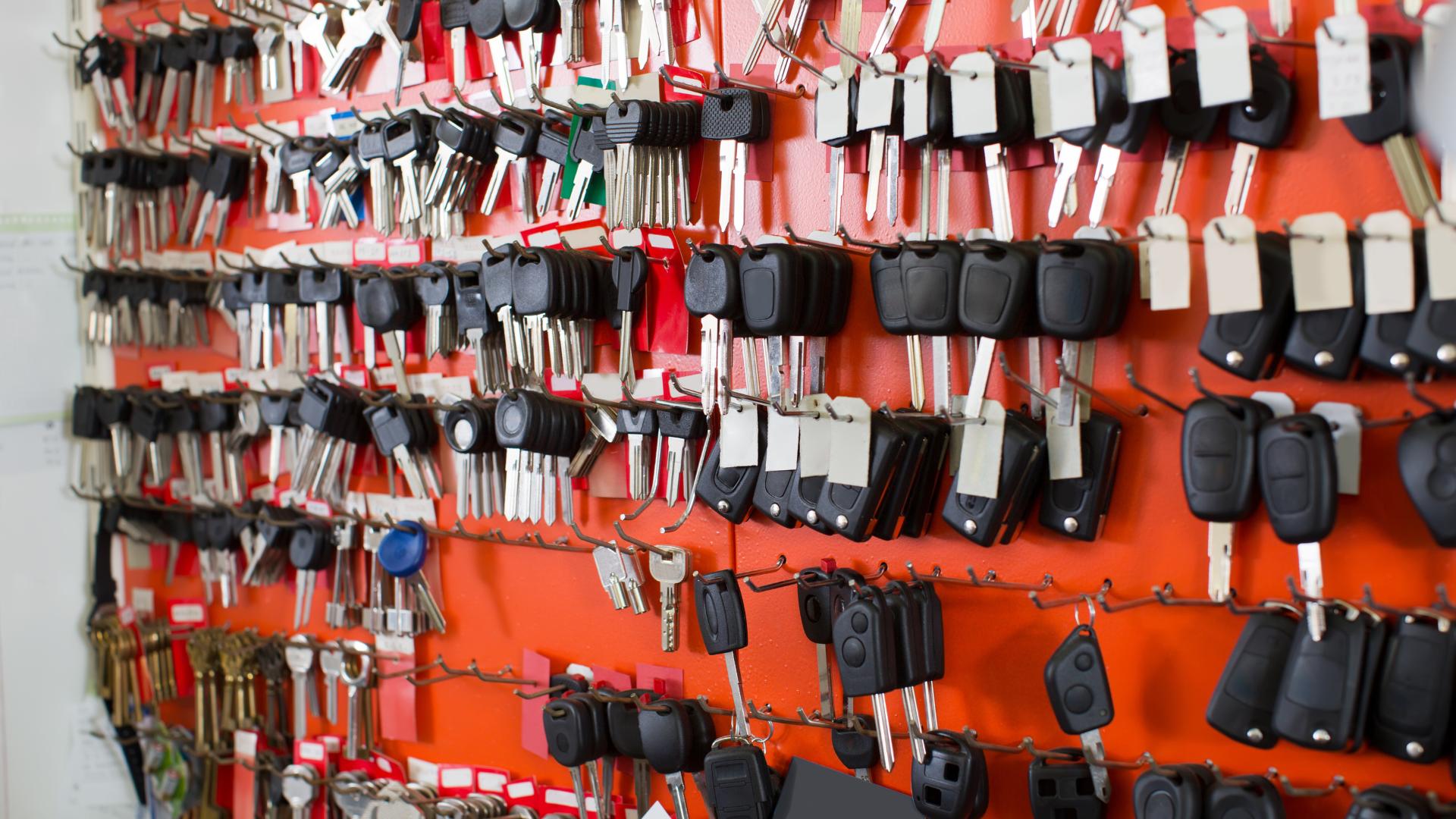 Wall of car key blanks and transponders ready for cutting and programming
