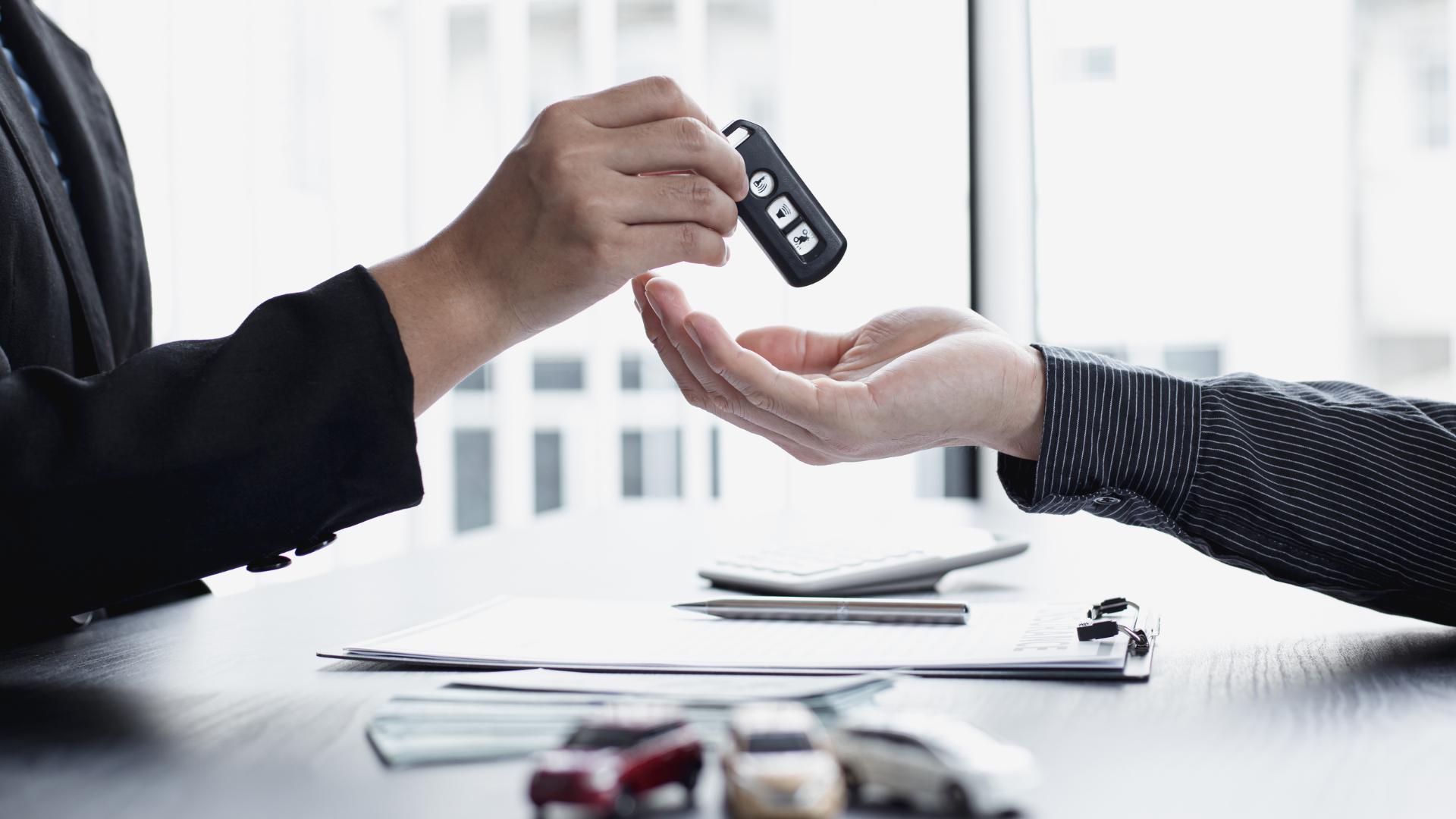 Customer receiving a freshly-cut replacement car key