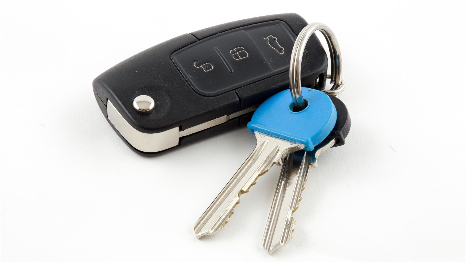 Modern push-to-start smart key fob in a vehicle interior