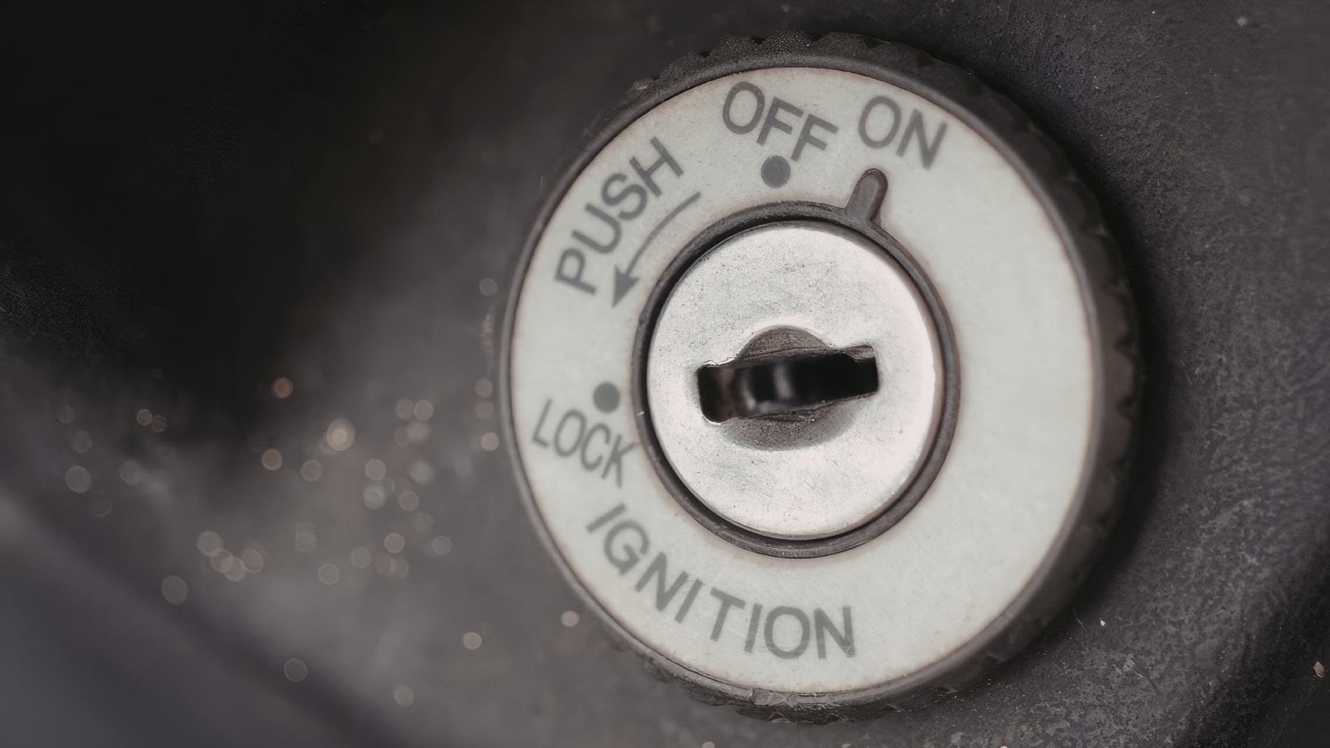 Close-up of ignition cylinder labels: PUSH OFF LOCK IGNITION